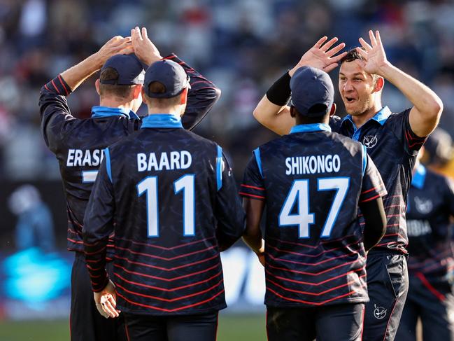 Namibia's JJ Smit (R) and teammates celebrate the wicket of Sri Lanka's Chamika Karunaratne during the Australia 2022 Twenty20 World Cup cricket tournament match between Sri Lanka and Namibia at Kardinia Park in Geelong on October 16, 2022. Picture: Martin Keep