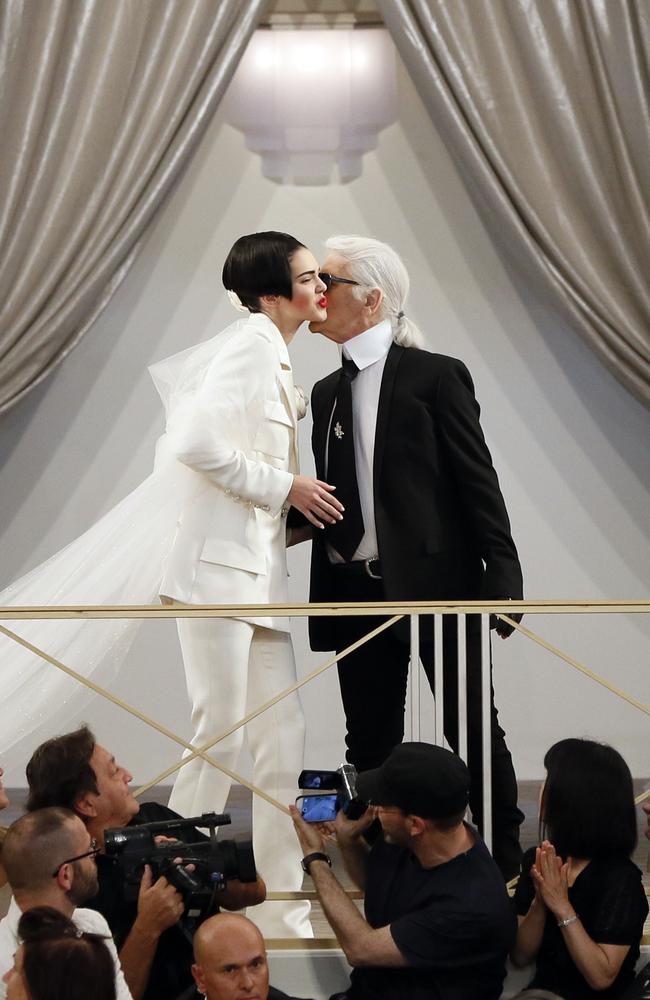 German fashion designer Karl Lagerfeld kisses US model Kendall Jenner during the Chanel 2015-2016 fall/winter Haute Couture collection fashion show. Picture: AFP