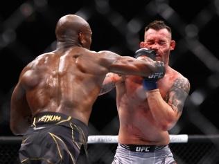 NEW YORK, NEW YORK - NOVEMBER 06: (L-R) Kamaru Usman celebrates punches Colby Covington in their welterweight title bout during the UFC 268 event at Madison Square Garden on November 06, 2021 in New York City. (Photo by Mike Stobe/Getty Images)