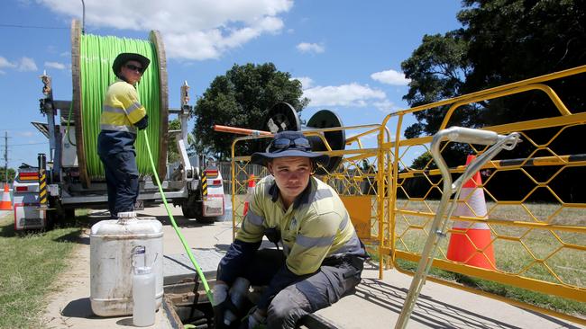 Workers lay NBN cable. Picture: Chris Higgins