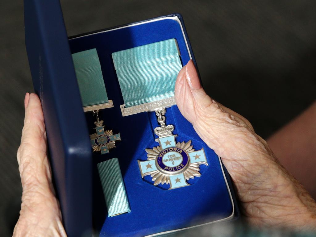 Constable Neil Clinch‘s mother Elvie with a Police Valour Award. Picture: George Salpigtidis