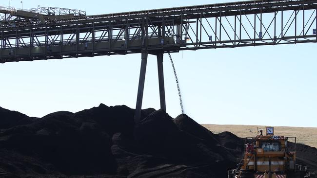 Coal in huge piles being prepared for a power station. Queensland and NSW are ­demanding commonwealth compensation to slap a price cap on coal. Picture: David Swift