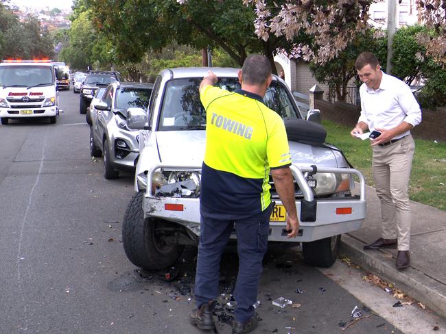 The Kia owner looking at the damage. Picture: OnScene Bondi