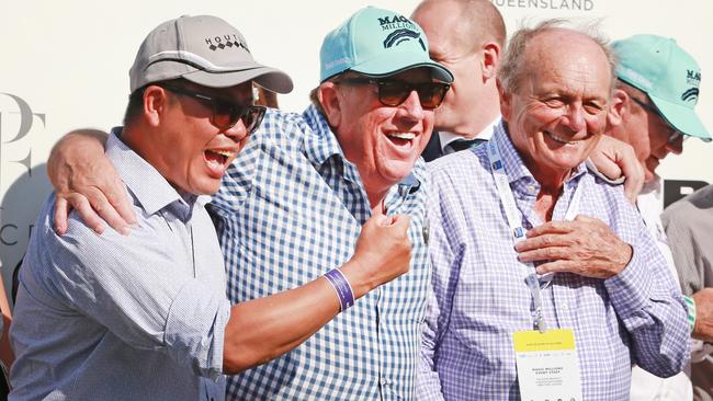 Houtzen part-owners Allen Ng and Chris Casey celebrate their filly’s win with Gerry Harvey. Picture: Tim Marsden