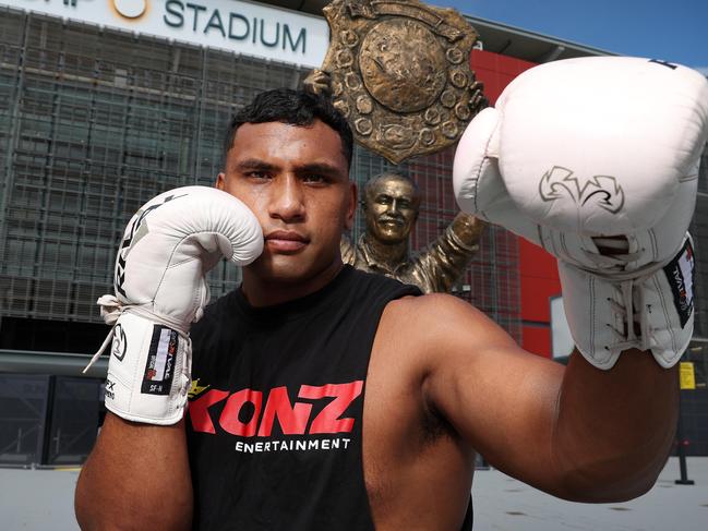 Tevita Pangai Junior outside Suncorp Stadium with the Wally Lewis statue, Milton. Picture: Liam Kidston