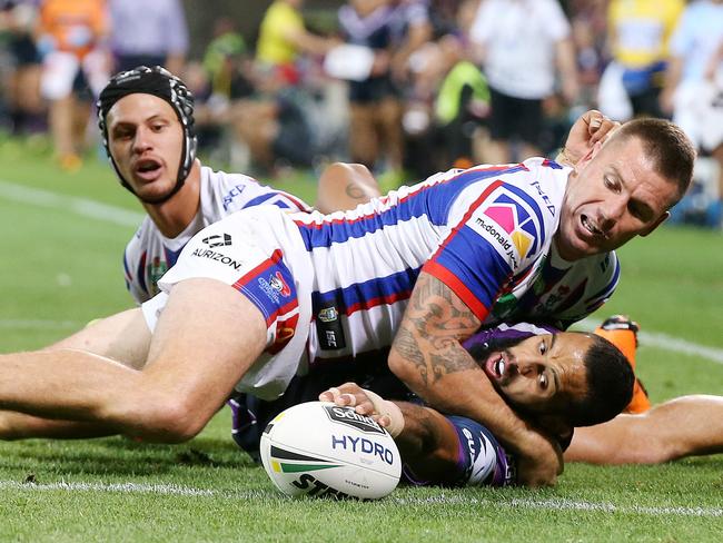 NRL Round 6. 13/04/2018. Melbourne Storm v Newcastle Knights at AAMI Park. Josh Addo-Carr gets the ball over the try line to score whilst being tackled 2nd half  . Pic: Michael Klein