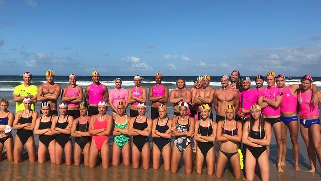 A group of surf life saving's biggest names pose together on the shores of Maroochydore in protest of the controversial Iron X event. SUPPLIED