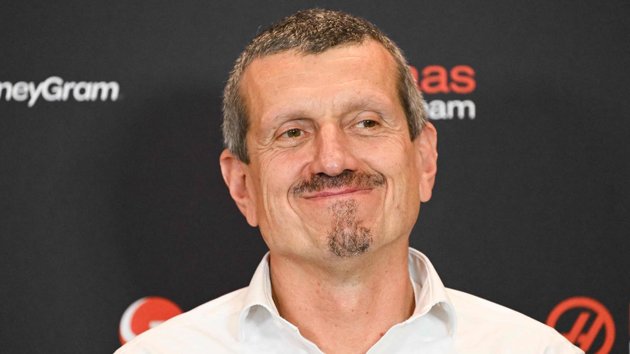 Haas F1 team principal Guenther Steiner smiles during a press conference. Photo by Patrick T. FALLON / AFP.