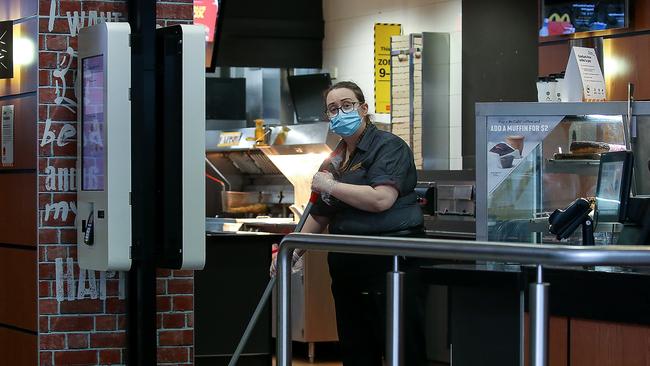 A McDonald’s worker in Melbourne’s Collins St store. Picture: Ian Currie