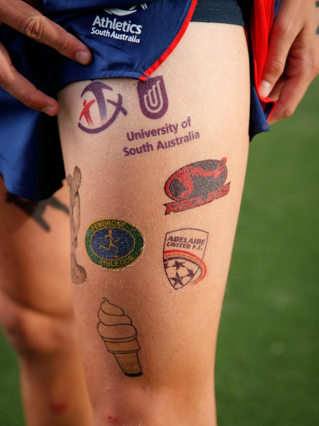 Isaac Heyne covered in temporary tattoos in honour of his mum who died of cancer. Picture: Matt Turner