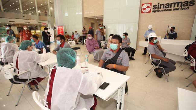 A Covid vaccination clinic run by a private business in Indonesia.