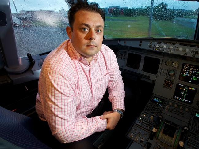 Strategic Airlines founder Michael James at Brisbane Airport with one of A320 planes in the fleet. Photographer: Liam Kidston.