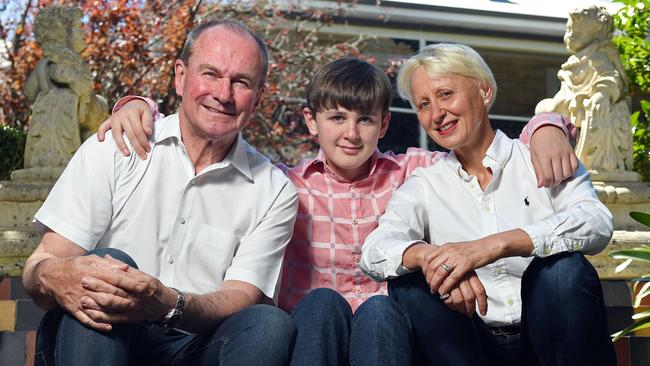 Martin Hamilton-Smith and his wife Stavroula Raptis flank their son Thomas at their Stirling home. Picture: Tom Huntley