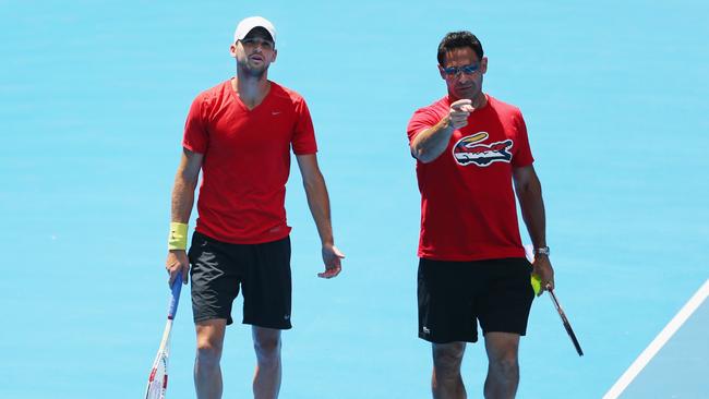 Grigor Dimitrov of Bulgaria talks with his then coach Roger Rasheed during training ahead of the 2014 Australian Open. Picture: Scott Barbour/Getty Images