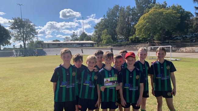 The Highfields Under-11 Kangaroos Green (from back left) Callan, Daly, Ethan, Cooper, Amy and Piper, Kirwan, Lincoln, Cody and Lachlan are the Football Queensland Darling Downs Team of the Week. Dexter and Ben were absent from the photo.