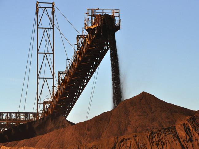 stock mining pics Iron ore being stockpiled at Fortescue Metals Group's first mine, Cloudbreak, about 280km southeast of Port Hedland in Western Australia. AAP Image/Rebecca Le May (NO ARCHIVING) * The pics were taken on a media tour on Monday.