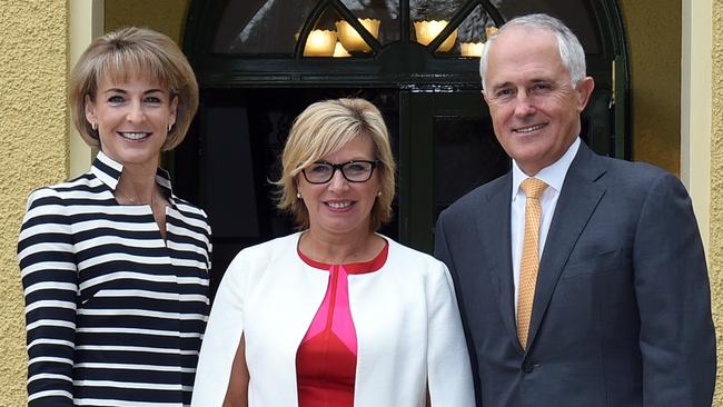 Rosie Batty, centre, pictured with Minister for Women Michaelia Cash and Prime Minister Malcolm Turnbull, is preparing to pass on the Australian of the Year baton. Credit: AAP