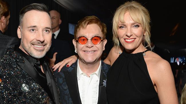 WEST HOLLYWOOD, CA - FEBRUARY 26: (L-R) Hosts David Furnish and Elton John, and actro Toni Collette attends the 25th Annual Elton John AIDS Foundation's Academy Awards Viewing Party at The City of West Hollywood Park on February 26, 2017 in West Hollywood, California. (Photo by Michael Kovac/Getty Images for EJAF)