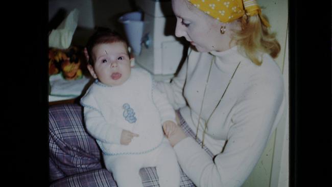 Adam Reilly, aged four months, with his adopted mother Beverley at home in Adelaide in 1975. Picture: Supplied