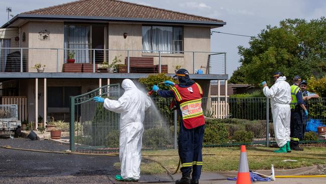 Emergency services workers at the house on Sunday where Eric Newman shot police officers from his balcony. Picture: Julian Andrews