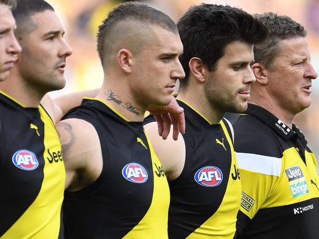 Martin during the national anthem ahead of the prelim final with his Tigers teammates and coach Damian Hardwick. Picture: AAP