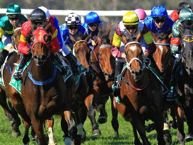 Loving home ridden by Tye Angland  (yellow cap, maroon with yellow armbands) wins race 1 during Scone  Races located in the Upper Hunter Region of NSW. The Bend . Pic Jenny Evans