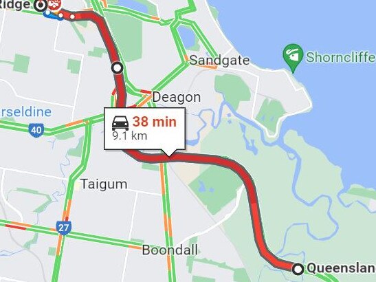 A Google traffic map shows delays on the M1 Gateway Motorway