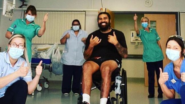 Mose Masoe with some of the hospital staff helping him with his rehabilitation.