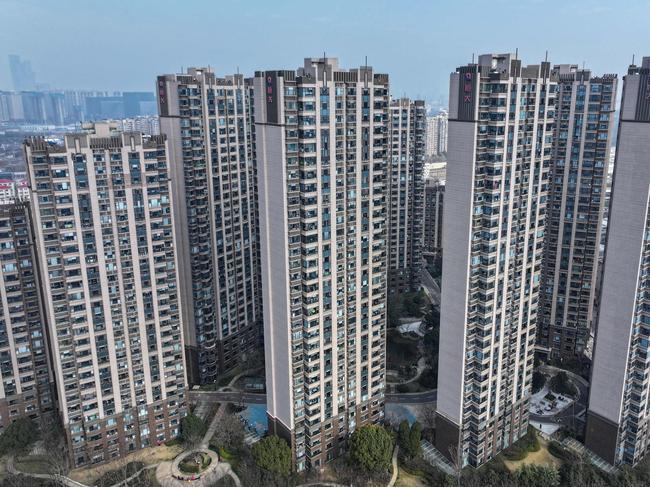 This aerial view shows a housing complex by Chinese property developer Evergrande in Nanjing, in China's eastern Jiangsu province on January 29, 2024. A Hong Kong court on January 29 ordered the liquidation of China's property giant Evergrande, but the firm said it would continue to operate in a case that has become a symbol of the nation's deepening economic woes. (Photo by AFP) / China OUT