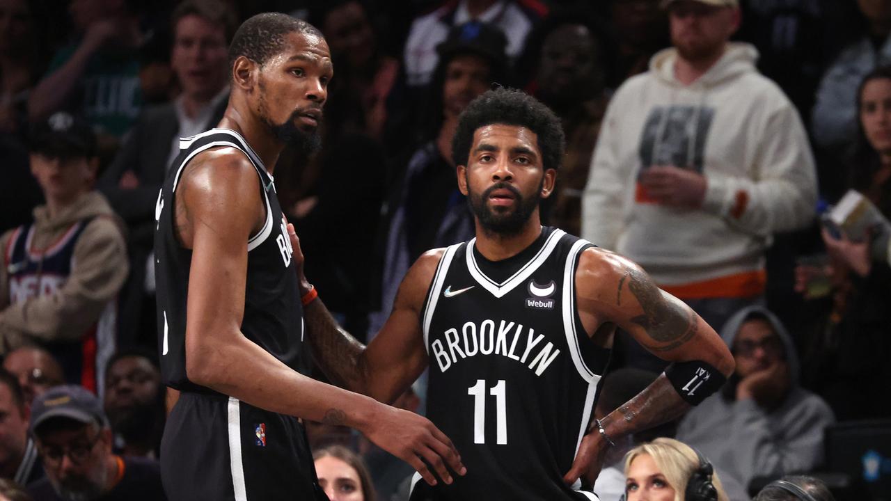 NEW YORK, NEW YORK - APRIL 23: Kevin Durant #7 and Kyrie Irving #11 of the Brooklyn Nets look on in the final seconds of their 109-103 loss against the Boston Celtics during Game Three of the Eastern Conference First Round NBA Playoffs at Barclays Center on April 23, 2022 in New York City. NOTE TO USER: User expressly acknowledges and agrees that, by downloading and or using this photograph, User is consenting to the terms and conditions of the Getty Images License Agreement. (Photo by Al Bello/Getty Images).