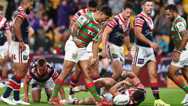 Latrell Mitchell spikes the ball and screams after scoring a try during their clash against the Roosters last year. Picture: Chris Hyde/Getty Images