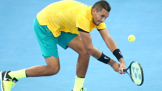 Nick Kyrgios makes a shot against Sam Querrey from the USA. Colour and action at the Davis Cup Tie between Australia and the USA at Pat Rafter arena. Pic Jono Searle.