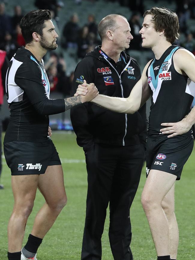 Chad Wingard with Jared Polec and Ken Hinkley after Port Adelaide’s final-round loss. Wingard has requested a trade to follow Polec at the door at Alberton. Picture Sarah Reed