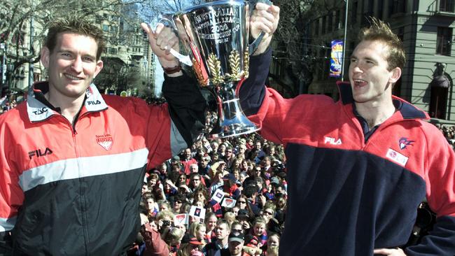 James Hird and David Neitz holding the trophy during the 2000 parade. Picture: HWT Library.