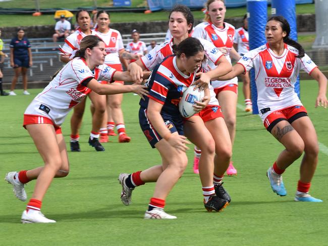 Tyra Dymock on her way to score a try. Picture: Sean Teuma