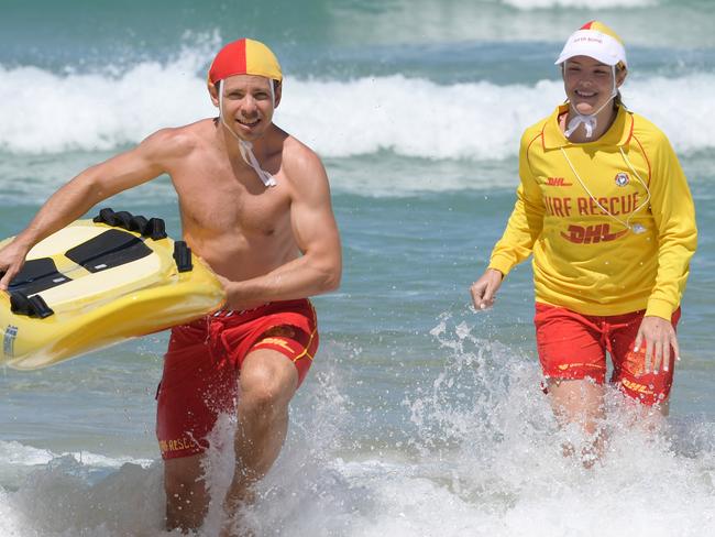 Lifesavers Peter McKerracher and Ilana Stringer on patrol at Bondi Beach yesterday. Picture: Simon Bullard