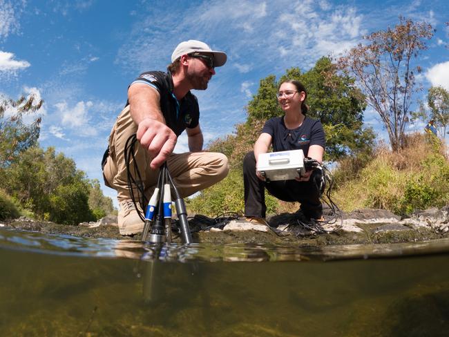 Townsville’s Healthy Waters Partnership brings together data from many members to produce its annual Report Card. Here, Adrian Macey from OzFish Unlimited and Kara-Mae Coulter-Atkins test water quality in the Bohle River. Picture: Supplied