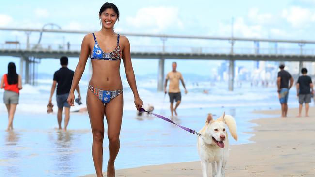 Rachel Halili and her dog Bonnie enjoy a beautiful day at the Spit on the Gold Coast. Pics Adam Head