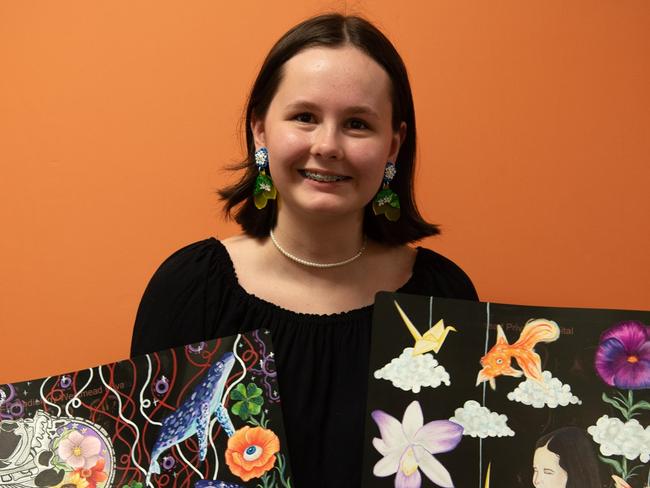 Darwin High School student Hayley Ryan holds their entrants for the Exit Art exhibition 2024. Picture: Georgina Campbell