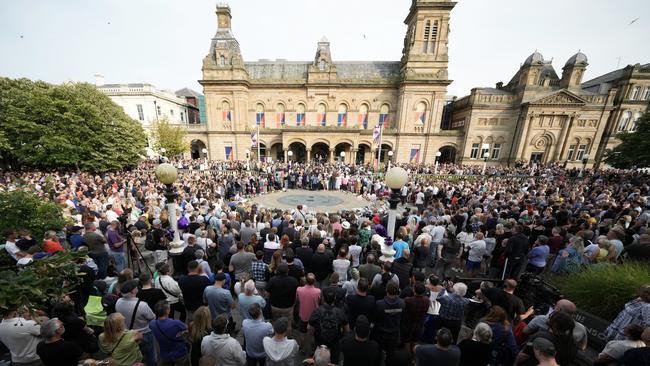 People attend a vigil outside the Atkinson building in central Southport for the child victims of the knife attack. Picture; Getty Images.