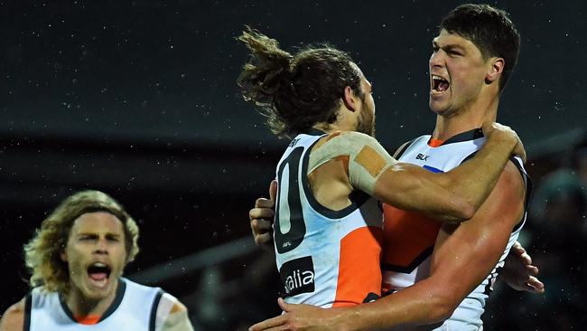 24/07/16 - AFL- Port Adelaide v GWS at Adelaide Oval. Greater Western SydneyÕs Jonathon Patton celebrates with team-mate Adam Kennedy after kicking a goal. Photo Tom Huntley