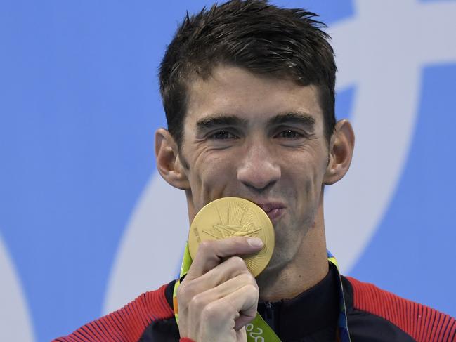 Adam Peaty is looking to emulate Michael Phelps (pictured) by winning a third straight gold medal in the same event. Picture: Christophe Simon/AFP