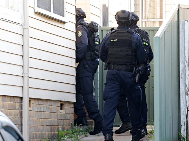 Police raid a home in Punchbowl on Tuesday. Picture: Adam Yip