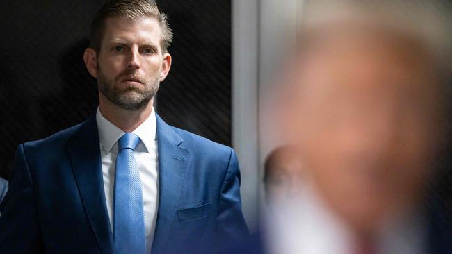 Eric Trump listens as his father former US President Donald Trump speak upon arriving at Manhattan Criminal Court for his trial on April 30, 2024. (Photo by JUSTIN LANE / POOL / AFP)