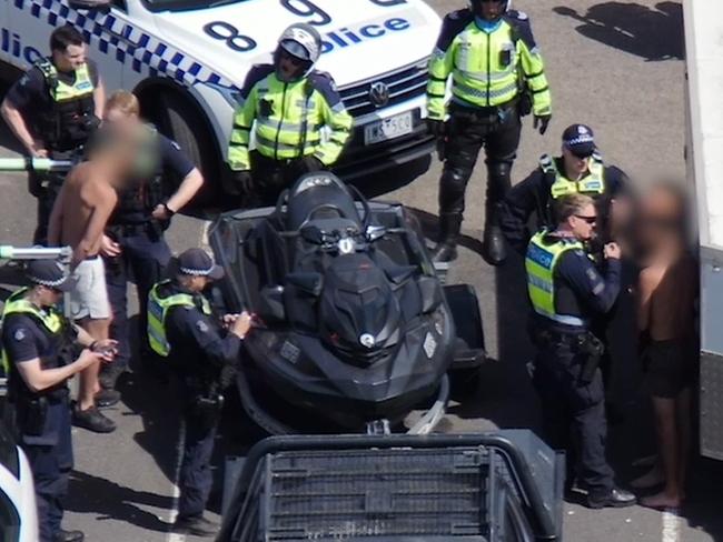 Jet ski hoons have been arrested for allegedly riding "dangerously close" to swimmers and assaulting a police officer. Picture: Vic Police