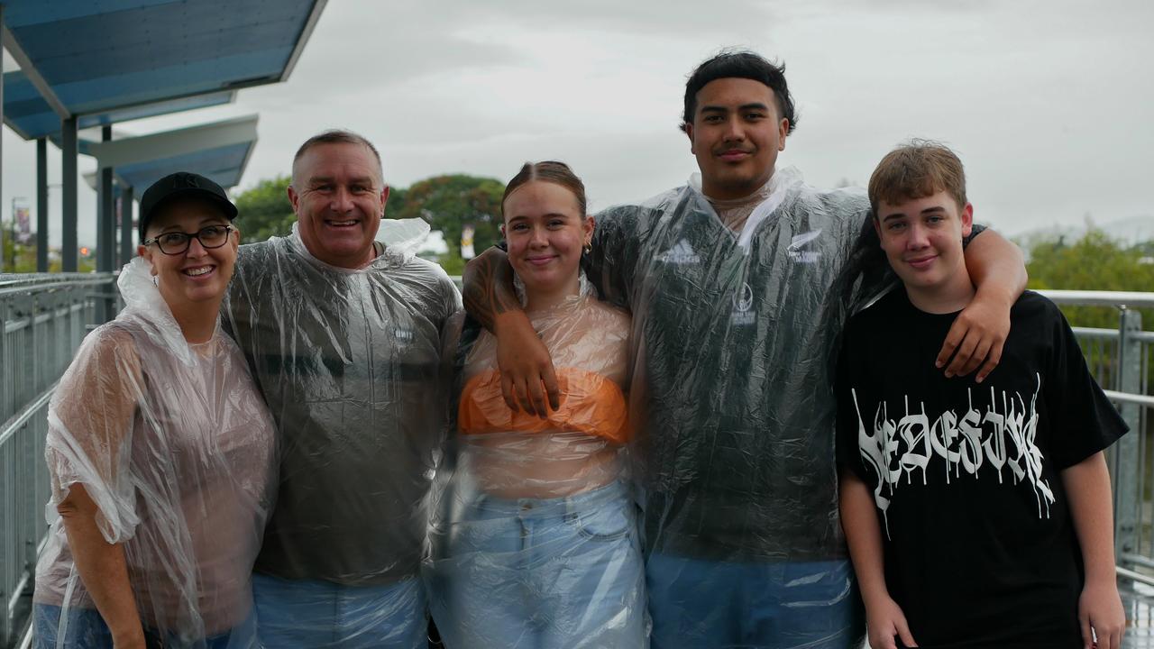 Jenny Lisle, Brendan Ashe, Kimmy Salmon, Koen Hutana and Darcy Salmon (almost all) had their ponchos ready to go on a wet night in Townsville. Picture: Blair Jackson