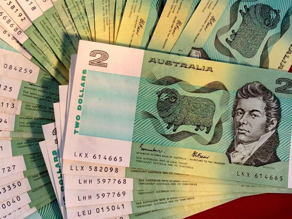 Old Australian $2 notes on a table