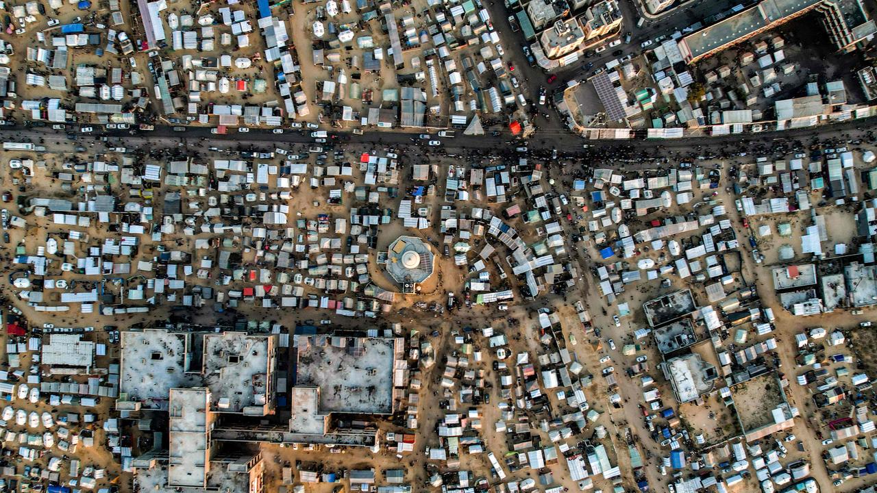 This aerial view shows the tent camps of displaced Palestinians in Rafah in the southern Gaza Strip close to the border with Egypt on December 31, 2023.