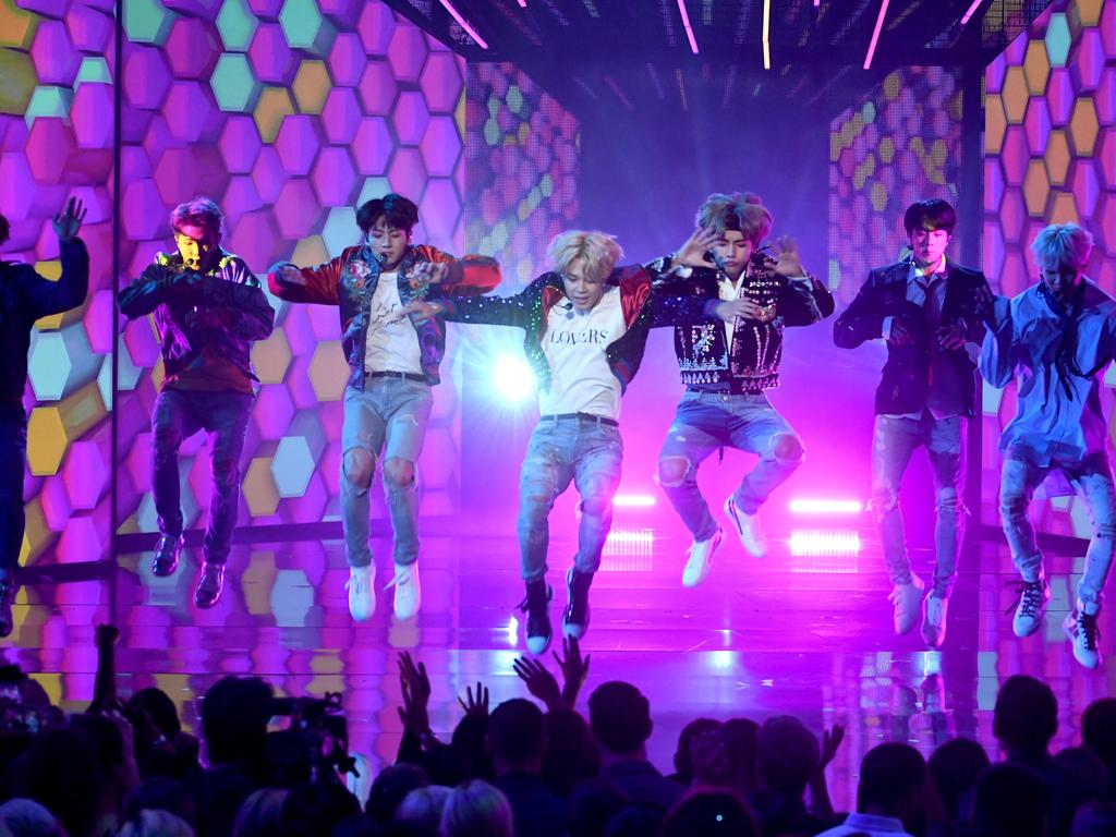 LOS ANGELES, CA - NOVEMBER 19: Music group BTS performs onstage during the 2017 American Music Awards at Microsoft Theater on November 19, 2017 in Los Angeles, California. (Photo by Kevin Winter/Getty Images)