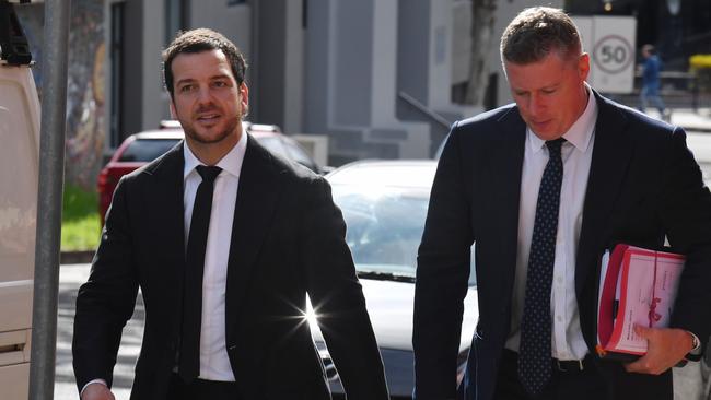 Former Newcastle Knights NRL player Jarrod Mullen (left) arrives at Wollongong Local Court in Wollongong. Picture: Dean Lewins